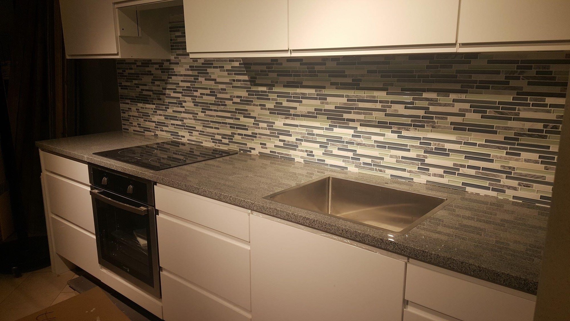 Glass and stone mosaic kitchen backsplash
