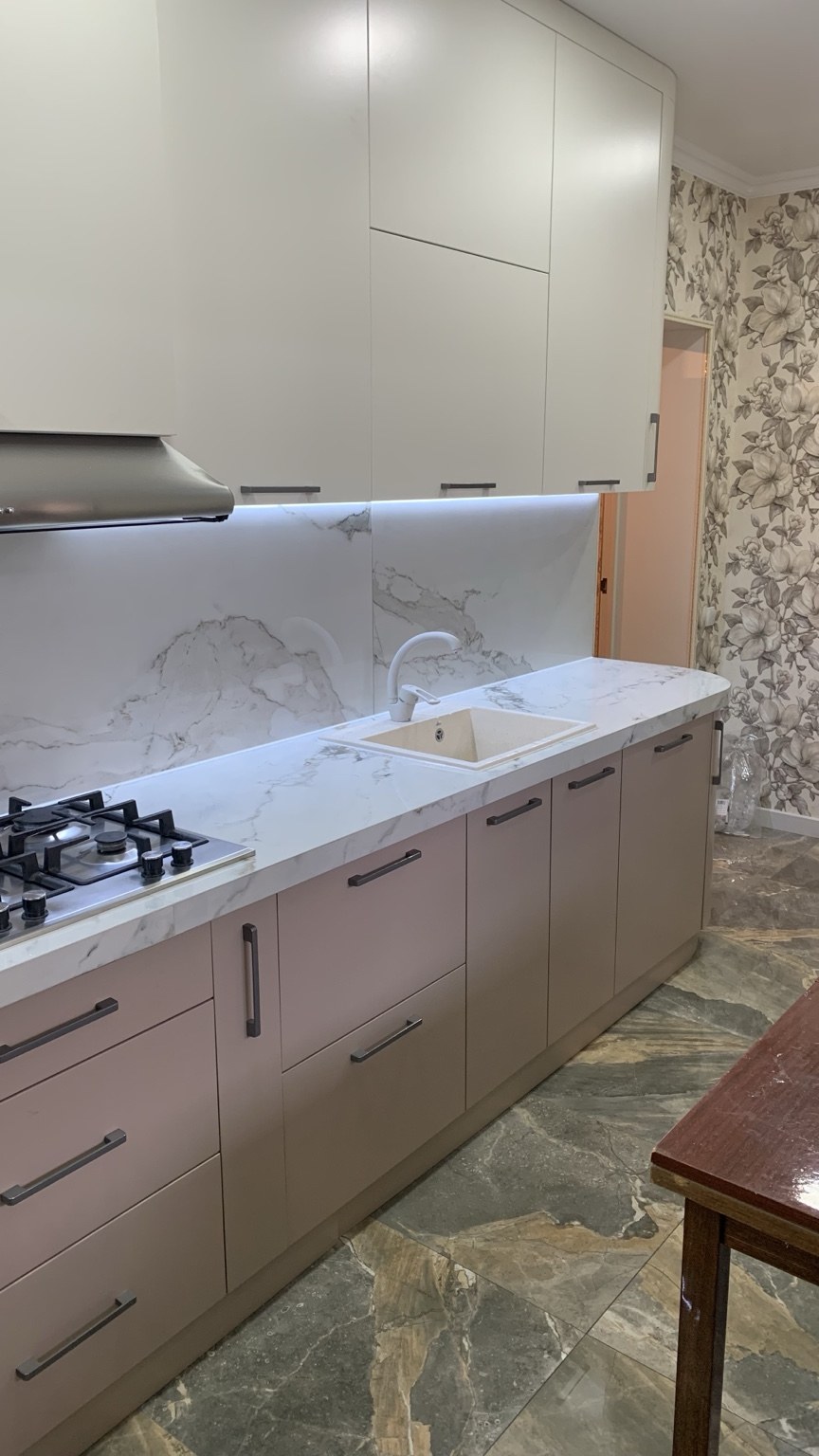 Marble-look kitchen backsplash by sink