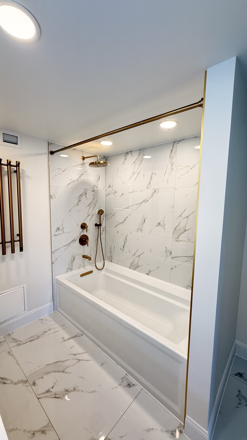 Bathtub with sliding glass enclosure