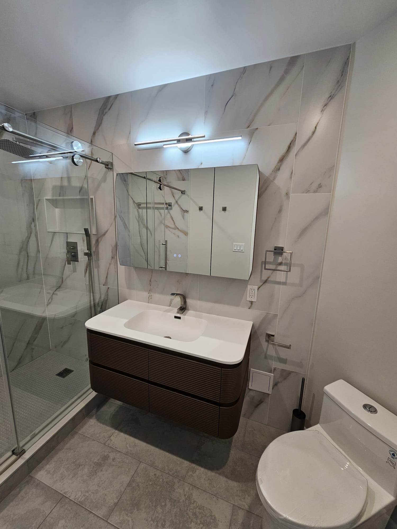 Bathroom vanity and glass shower