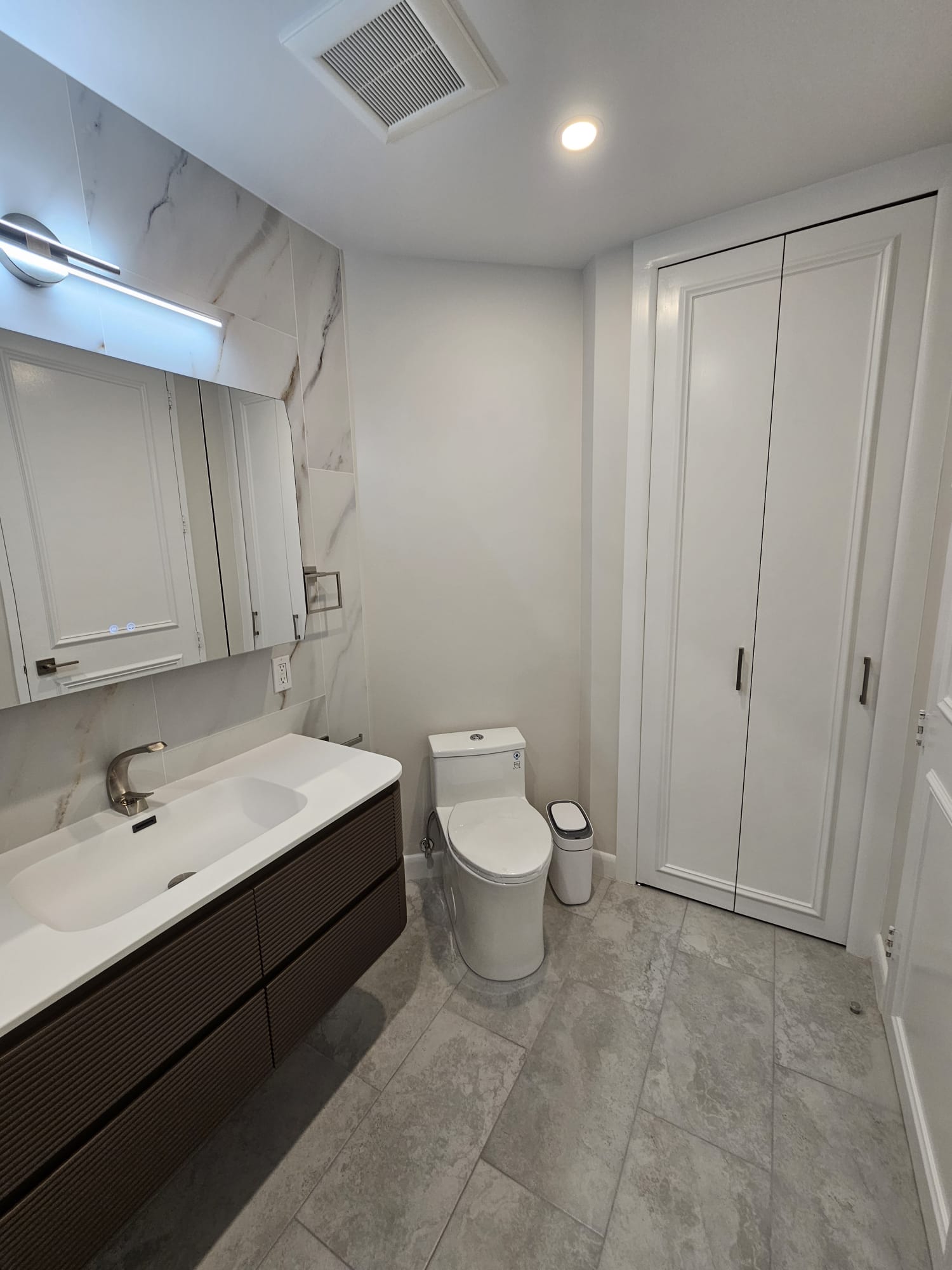 Gray bathroom floor and vanity