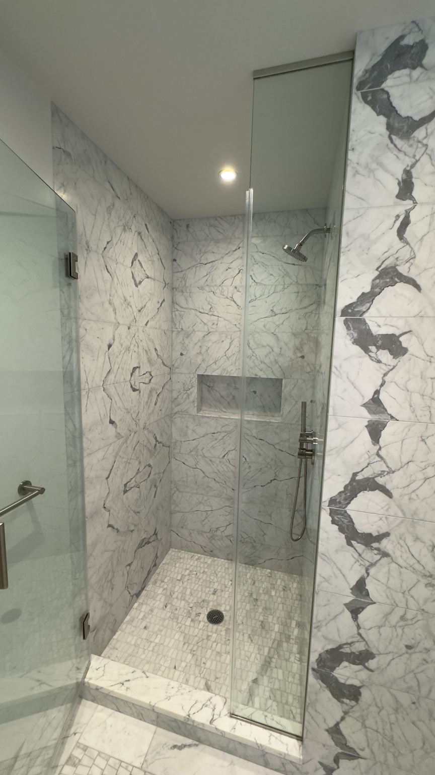 Marble shower and glass enclosure