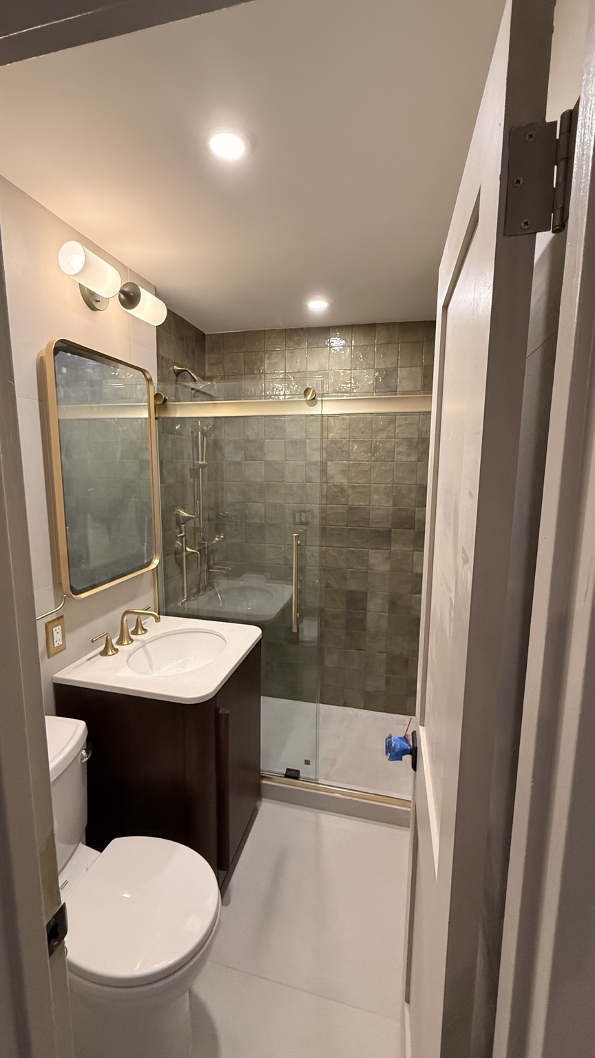 Bathroom with green shower tile
