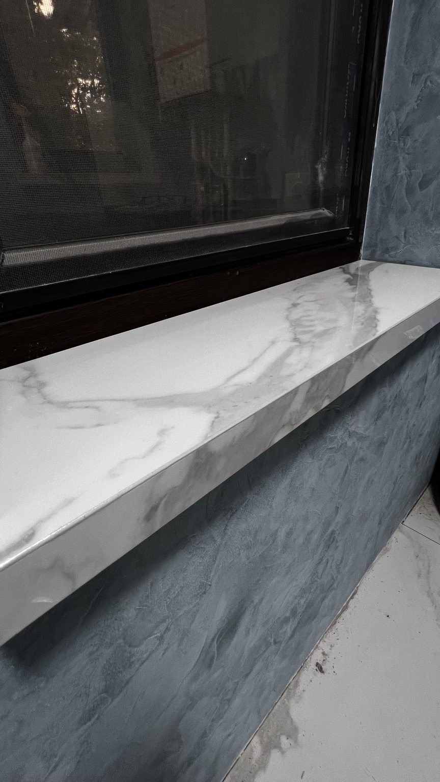 Marble-look window sill with a mitered front edge